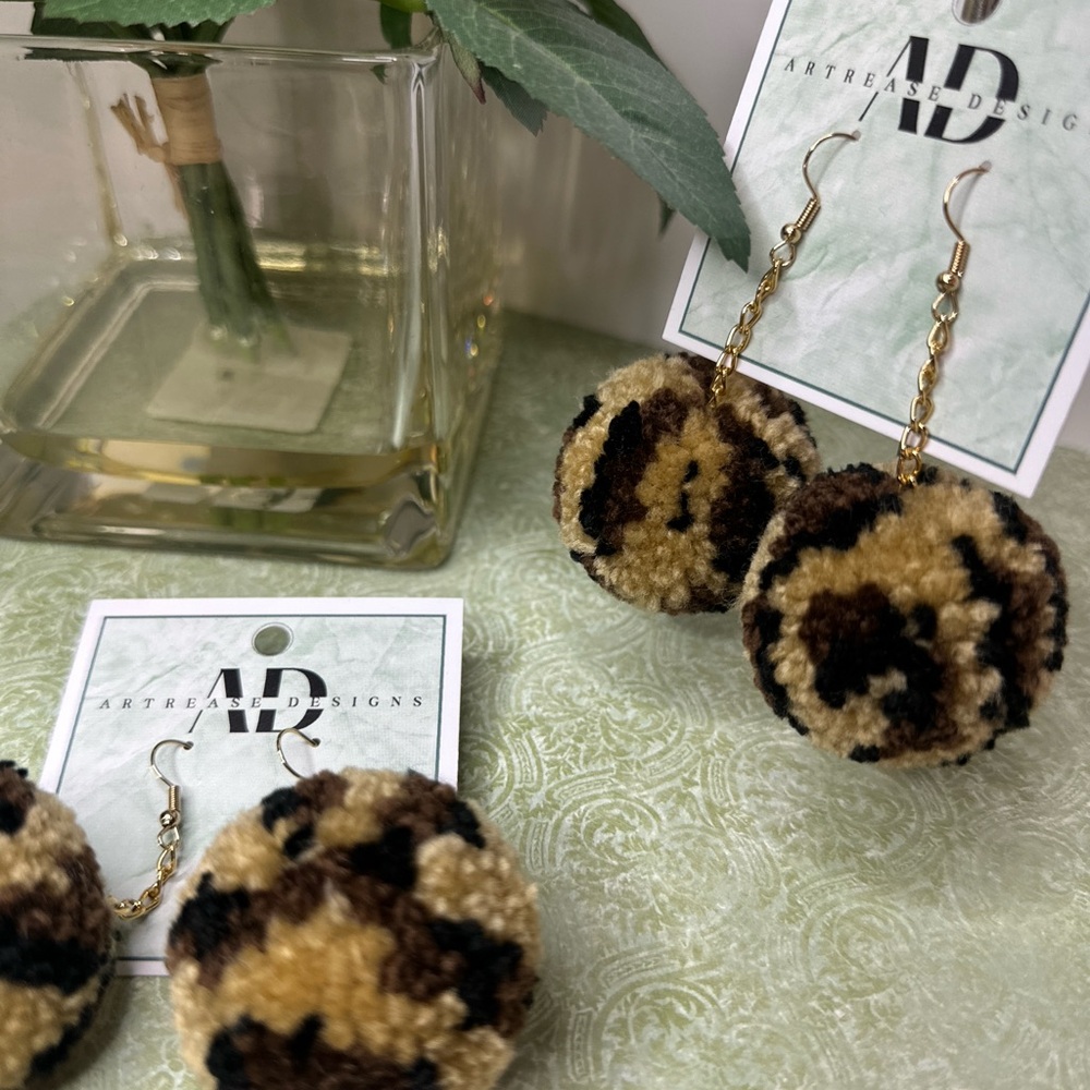 Cheetah Print Pom Pom Earrings
